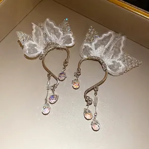 Elegant silver butterfly lace ear cuffs with shimmering iridescent crystal pendants