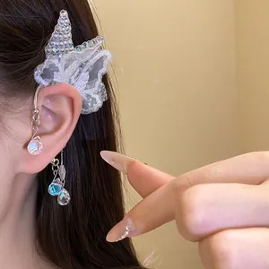 Close-up detail of lace butterfly ear cuff with sparkling crystal teardrop pendants