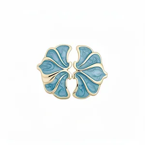 Vintage palace style floral stud earrings featuring light blue enamel and elegant gold plating