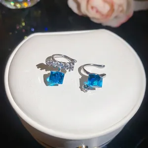 Sparkling silver ear cuffs featuring blue square zircon drops for non-pierced ears.