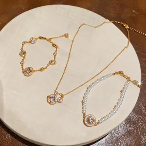 Ensemble luxueux collier étoile à huit branches en zircon doré et bracelet de perles