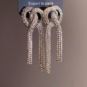 Elegant long tassel earrings with sparkling rhinestones and interlocking circular design