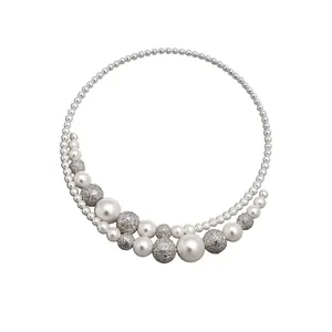 Elegant French style choker with white pearls and silver openwork beads on white background