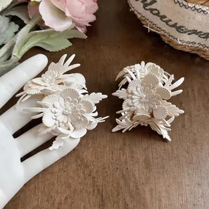 Elegant French vintage white leather flower earrings with pearl accents for women.
