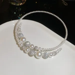 Close-up of elegant French retro pearl choker with sparkling rhinestone beads