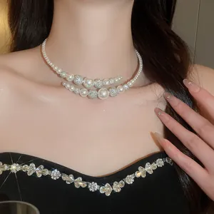 Close-up of French vintage double-layer pearl and crystal beaded choker on model.