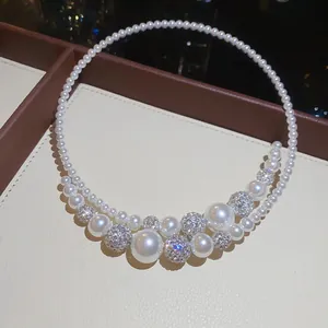 Detail shot of French vintage pearl choker necklace with sparkling rhinestone beads