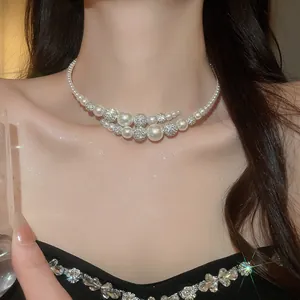 Elegant French retro pearl choker necklace with sparkling beaded accents on model's neck
