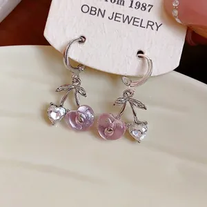 Sweet pink heart-shaped cherry resin earrings featuring sparkling rhinestone details