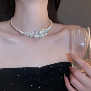 Detailed view of an elegant French retro pearl choker necklace worn by a female model