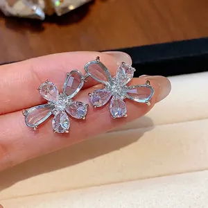 Delicate silver flower stud earrings featuring sparkling teardrop zircon petals for women.