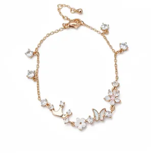 Rose gold bracelet with zircon crown butterfly and shell flower charms.