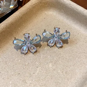 Detailed macro view of elegant silver needle flower stud earrings with zircon water drop petals