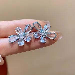 Detailed close-up view of elegant flower stud earrings with sparkling water drop zircon.