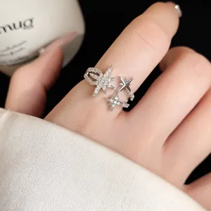 Close-up macro view of the intricate zircon star design on a sparkling silver open ring
