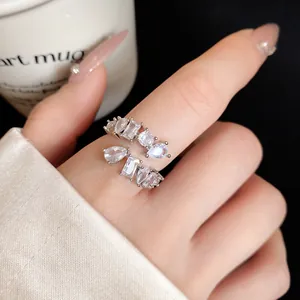 Close-up detail of an elegant Korean style adjustable open ring with geometric clear zircons