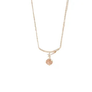 Elegant gold necklace featuring a sparkling round zircon pendant with a small star accent