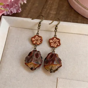 Vintage ethnic metal earrings with wood flower and resin drop