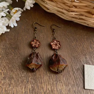 Vintage ethnic style drop earrings with wooden flower bead and seed pod pendant
