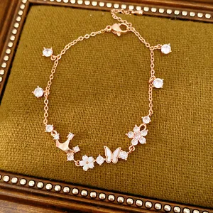 Close-up view of rose gold crown butterfly bracelet with zircon and mother of pearl