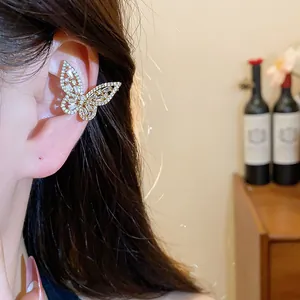 Elegant sparkling butterfly ear cuff with cubic zirconia worn on ear for non-pierced style