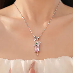 Elegant popsicle necklace with pink zircon and dainty flower accents on silver ball chain