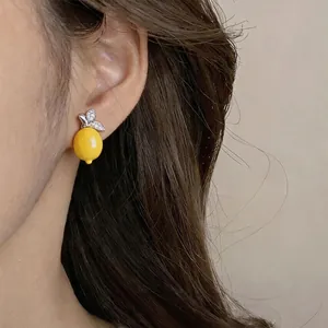 Elegant vintage resin lemon stud earrings featuring sparkling zircon-encrusted leaves