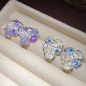 Elegant silver needle pearl flower stud earrings with crystal petals and dainty design