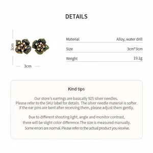 Detailed view of dark floral stud earrings with size and material specifications.
