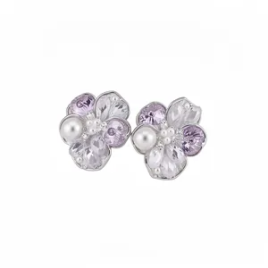 Elegant flower stud earrings featuring purple zircons and pearls in silver finish