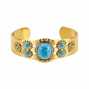 Vintage gold-plated open cuff bracelet with oval turquoise stones and boho floral details