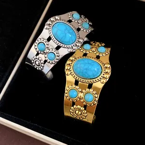 Detailed view of vintage bohemian turquoise cuff bracelets in silver and gold tones.