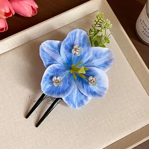 Elegant blue fabric flower hair fork with rhinestones for a stylish feminine look