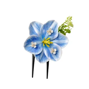 Elegant handcrafted blue fabric flower hair fork with rhinestones and green leaf accents