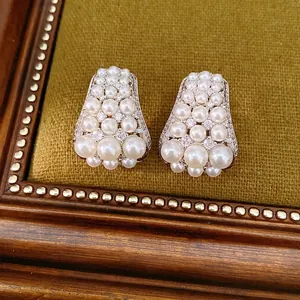 Elegant vintage trapezoid stud earrings featuring clustered white pearls and cubic zirconia
