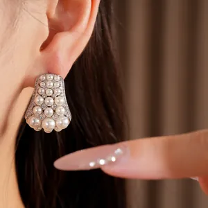 Detail view of exquisite court style silver needle zircon and pearl stud earrings