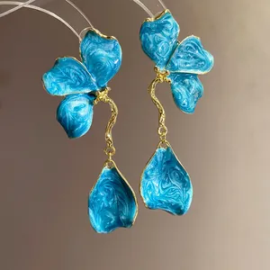 Exquisite vintage blue enamel flower pendant earrings with elegant golden wavy stem design