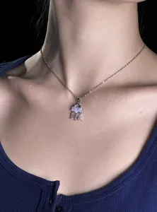 Close-up view of a light blue cloud-shaped zircon pendant necklace on a silver chain