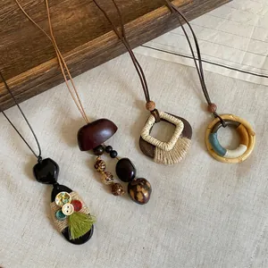 Detailed view of bohemian ethnic long necklaces with wood, seeds, and woven textures.