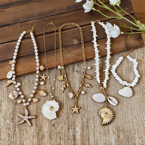 Detailed view of shell, starfish, and seahorse pearl necklaces on a rustic background