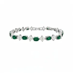Elegant silver bracelet featuring oval emerald green stones and clear floral zircon clusters
