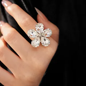 Detailed close-up showing the faceted teardrop crystals of this elegant flower-shaped ring