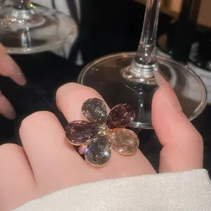 Macro view of a luxury multi-color crystal flower open ring for elegant banquet wear