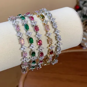 Detailed view showing various colorful floral zircon bracelets on a jewelry display.