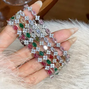 Elegant flower bracelets with sparkling zircons and colorful gemstones in macro view