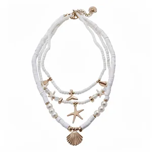 Bohemian multilayer beaded necklace with white clay pearls and gold starfish shell charms