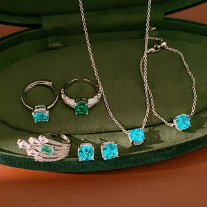 Complete set of blue cushion-cut cubic zirconia jewelry in elegant velvet box presentation.