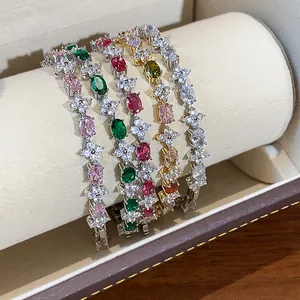 Close-up of sparkling zircon flower bracelets in multiple colors and finishes.