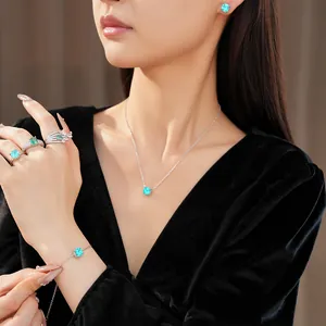Elegant blue zircon square jewelry set worn by a model in a lifestyle setting
