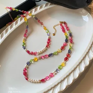 Detailed view of dopamine style colorful crystal beads and white pearls necklace set
